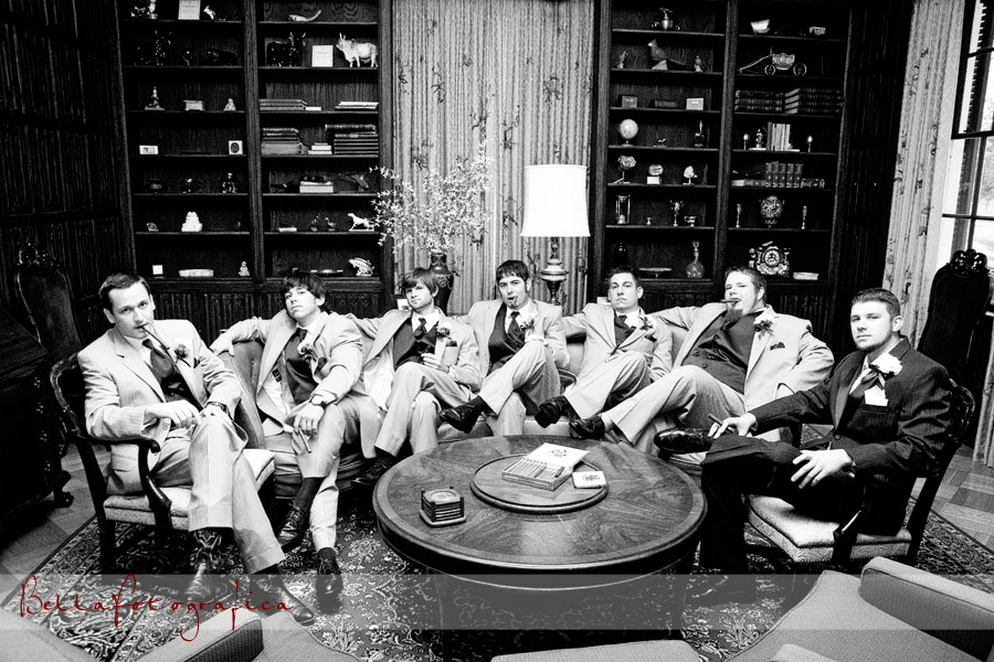 groom and groomsmen in cigar room
