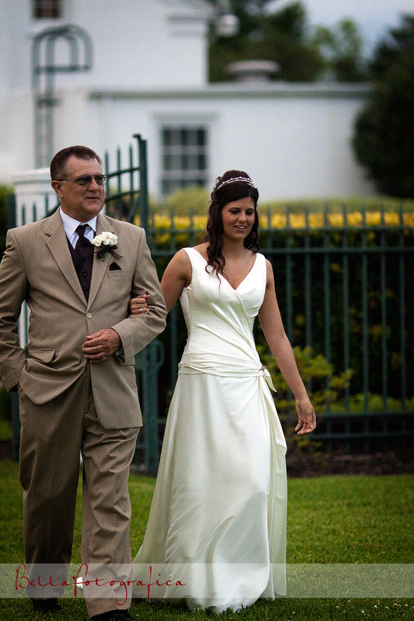 bride walking down aisle with her dad
