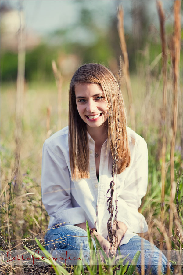 senior pictures in a field of cattails