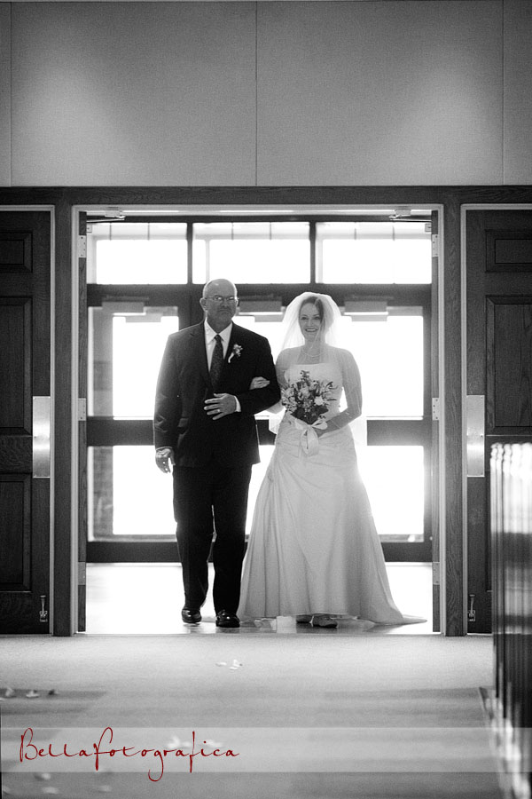 father and bride walking the aisle