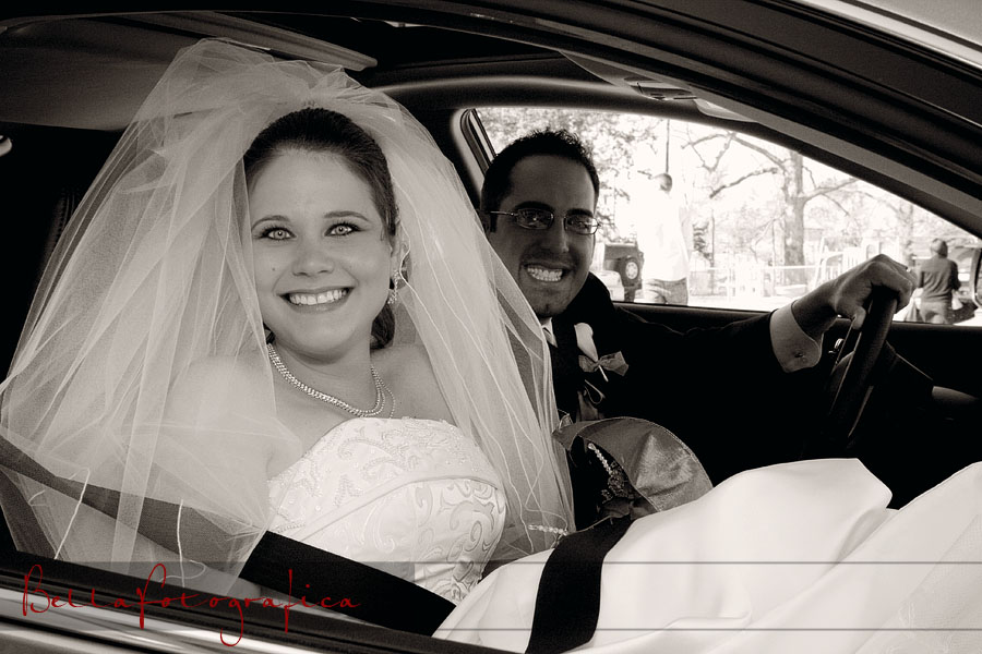 Bride and Groom in car making getaway