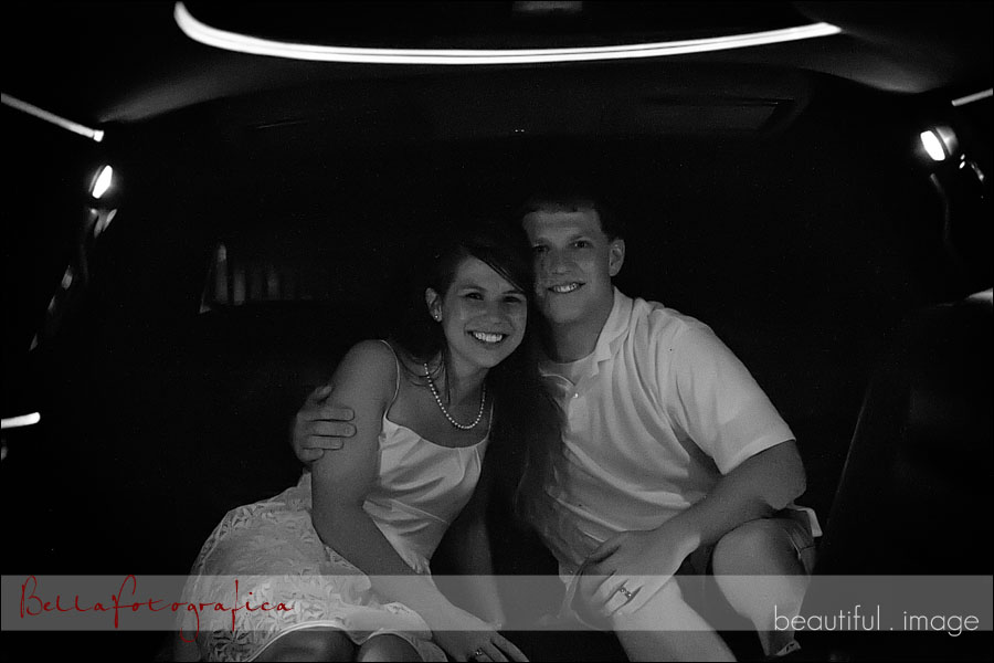 bride and groom in limo leaving for honeymoon