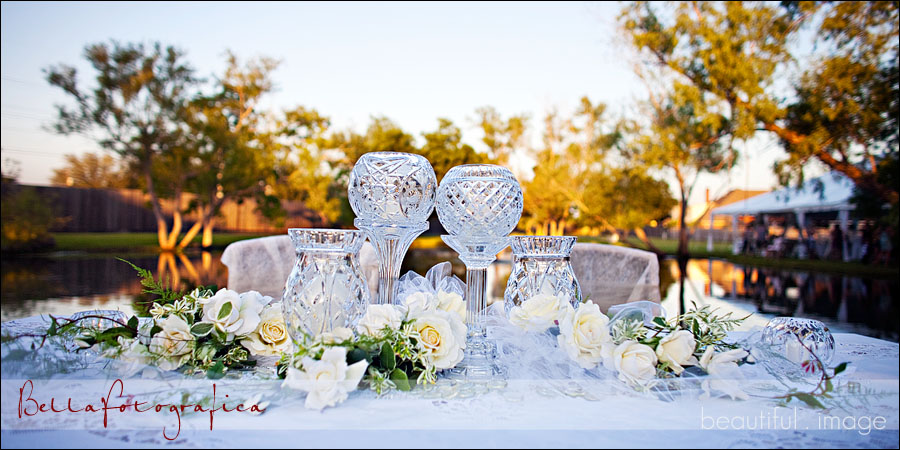 head table in nederland outdoor wedding reception with crystal and white roses