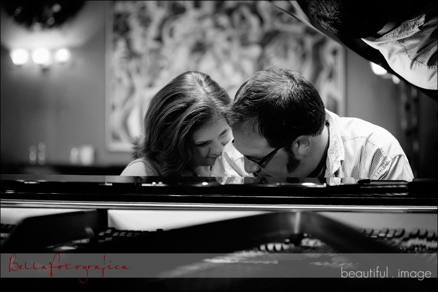 engaged couple sitting at a piano