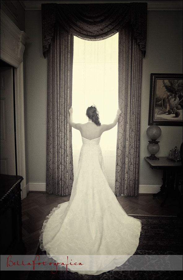 bride in front of bright curtains
