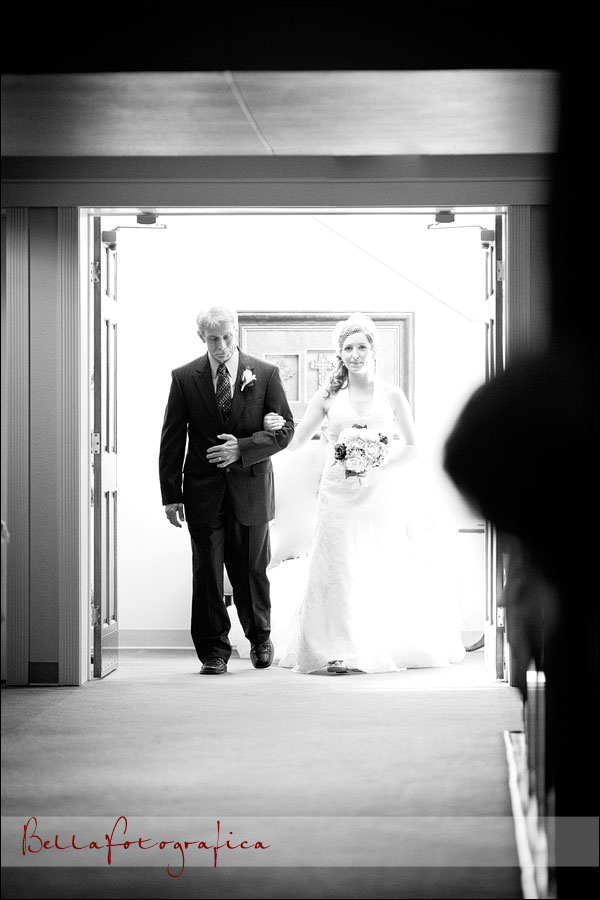 father of the bride and bride walking up the aisle