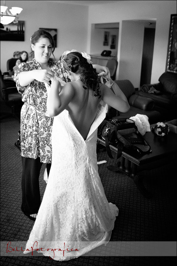 bride stepping into wedding dress