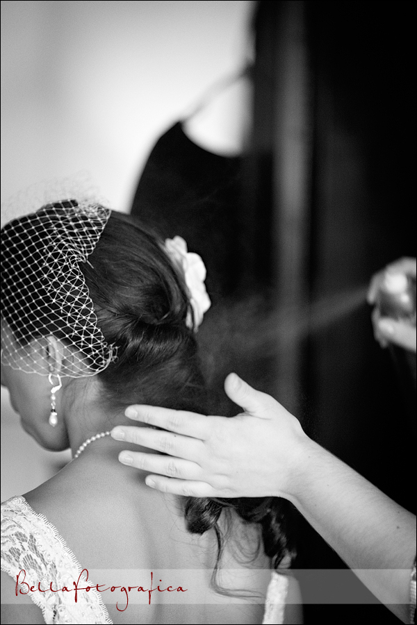 bride getting hair sprayed
