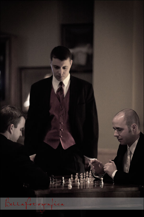 groom and best man playing chess