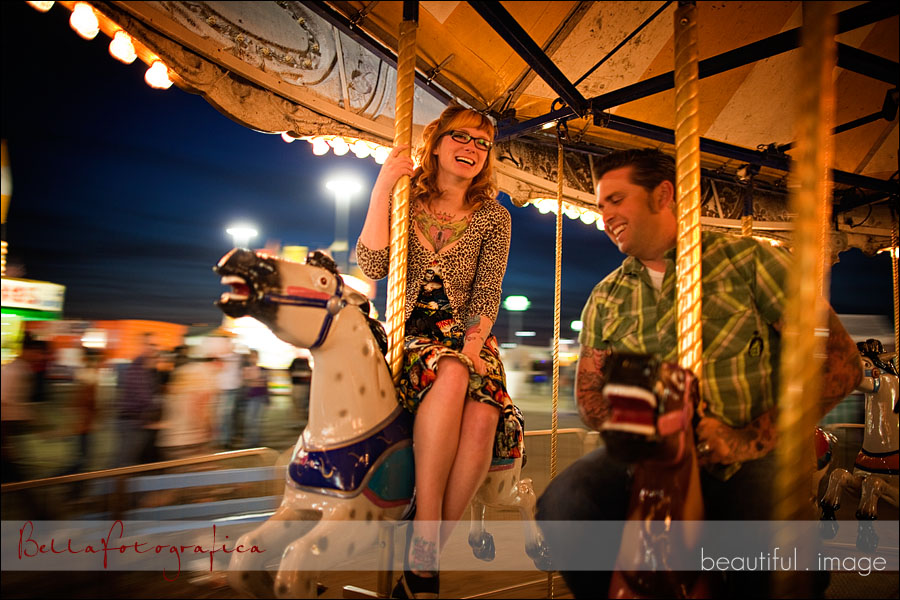 engaged couple on the carousel