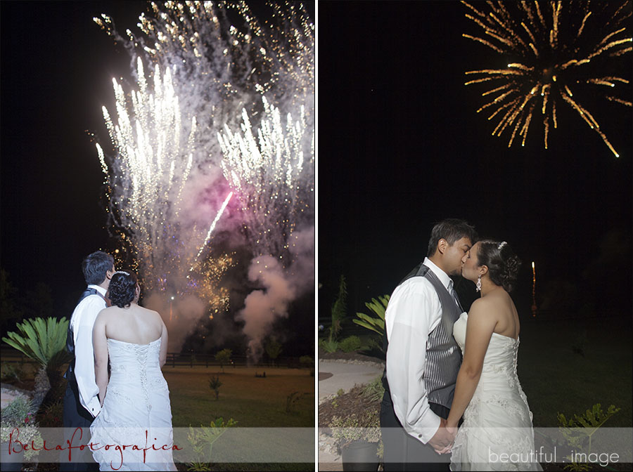 bride and groom watching fireworks at their wedding reception