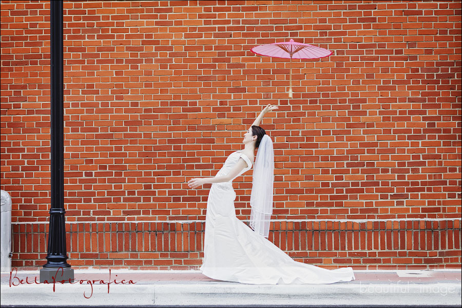 outdoor bridal photos with pink parasol