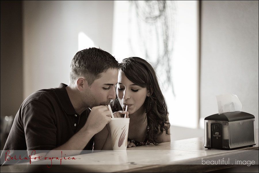 engaged couple sharing a vanilla shake