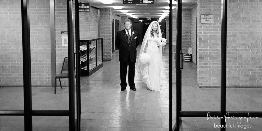 bride and her father about to walk down the aisle