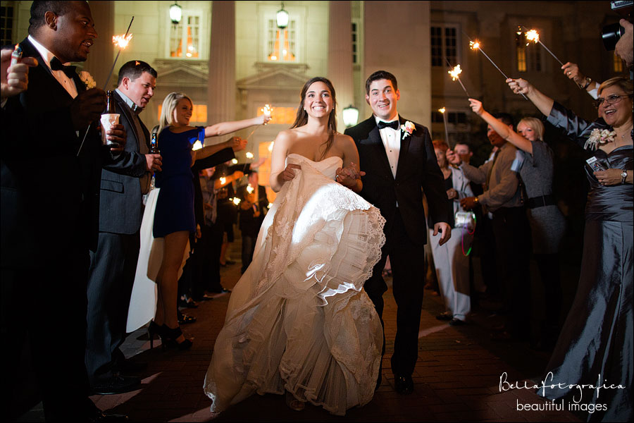 bride and groom leaving through sparklers