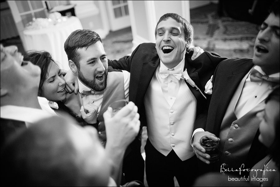 groom and his buddies singing at his reception