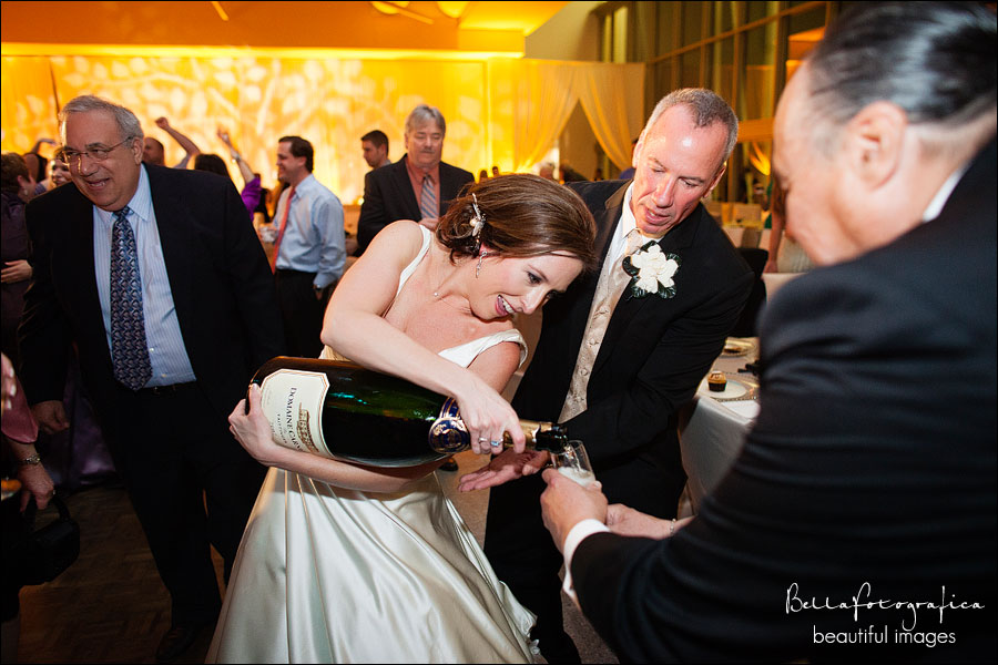bride and groom pouring champagne